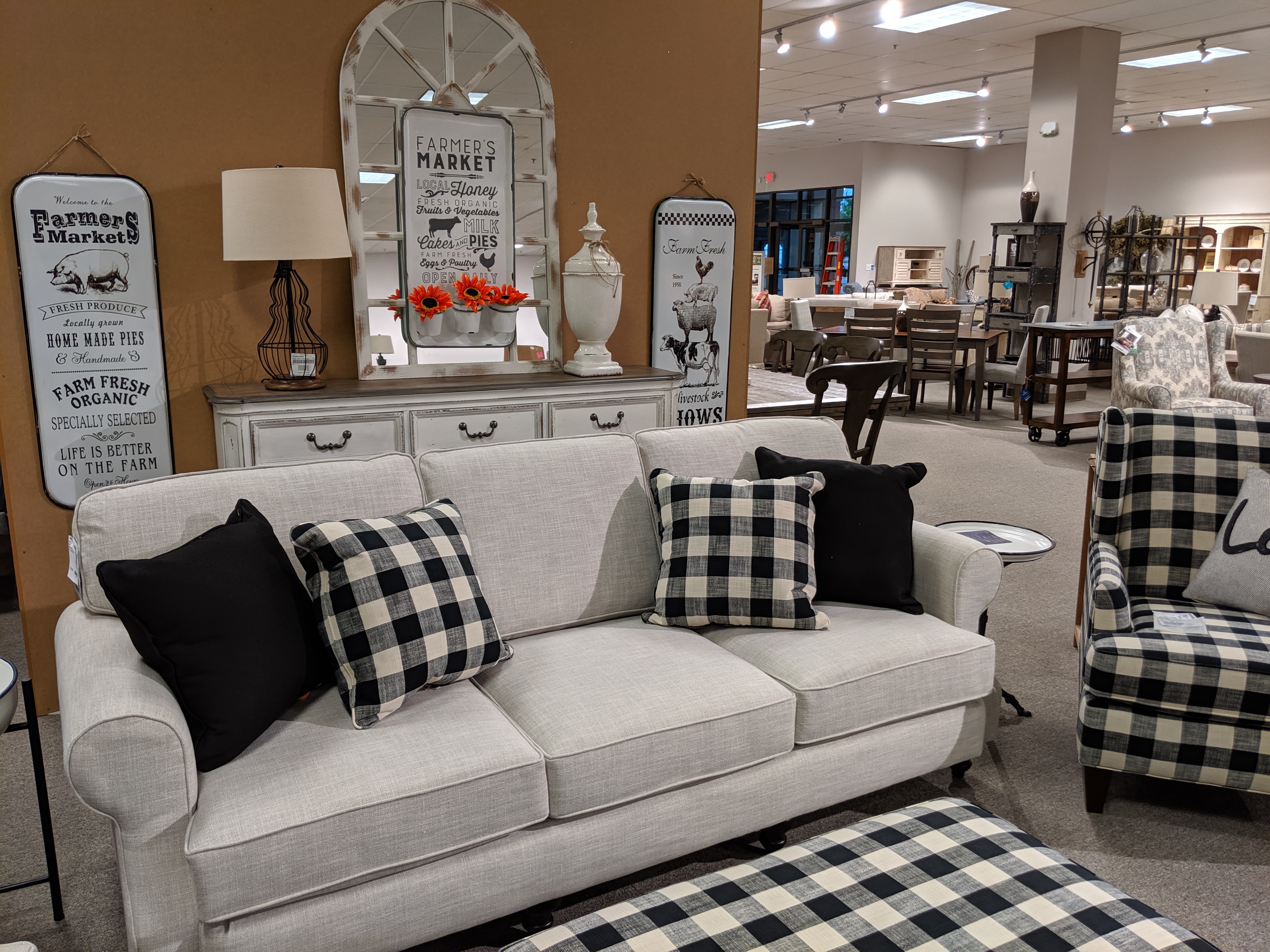 white sofa with four monochromatic pillows