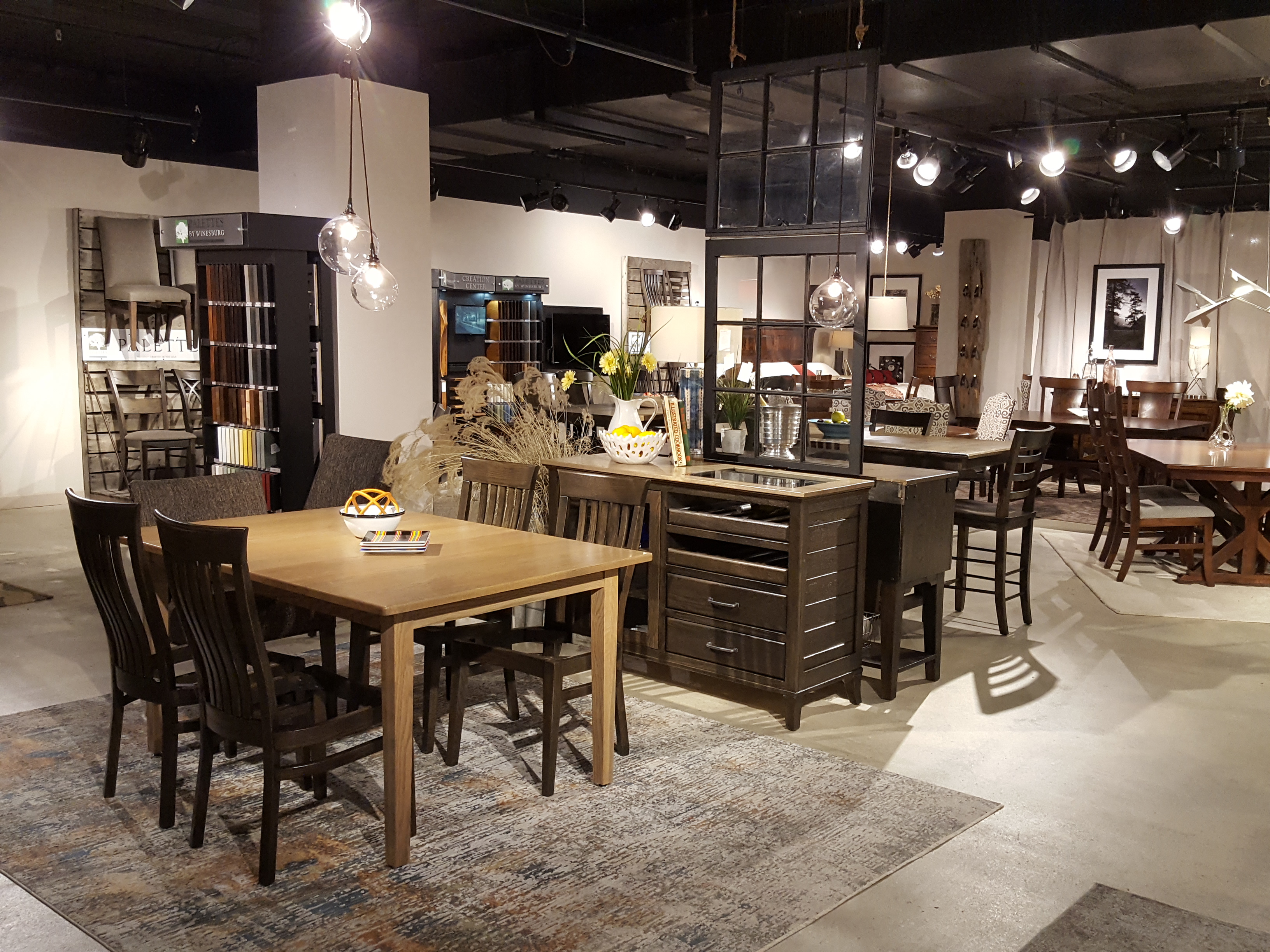 four-seater wooden dining table with matching chairs