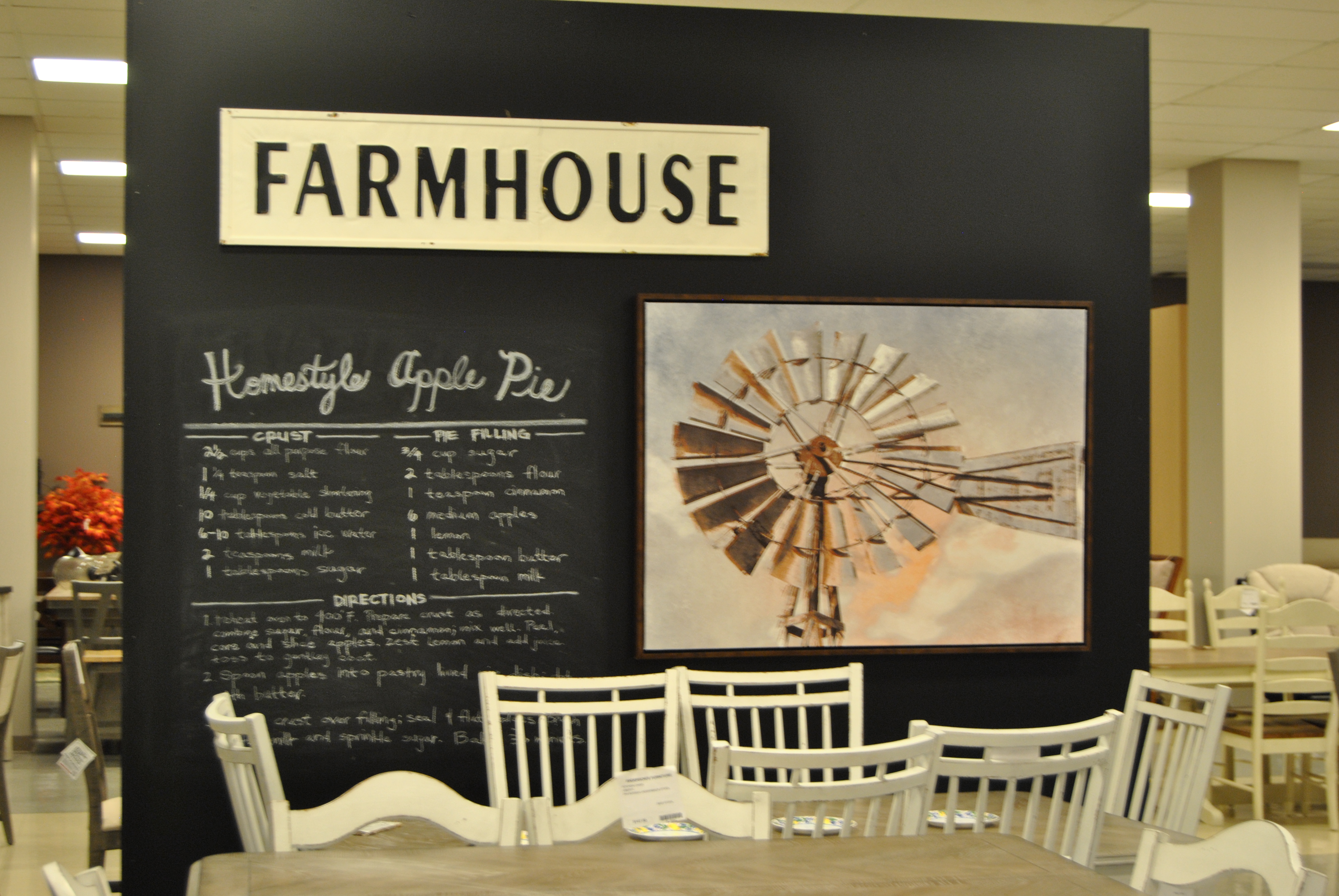 chalkboard with artwork and signage that says, “Farmhouse”